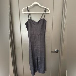 Black linen Reformation dress with a front slit